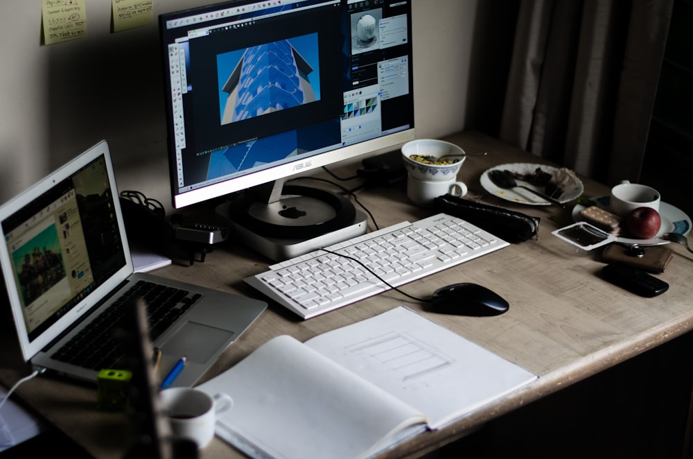 black flat screen computer monitor on brown wooden table