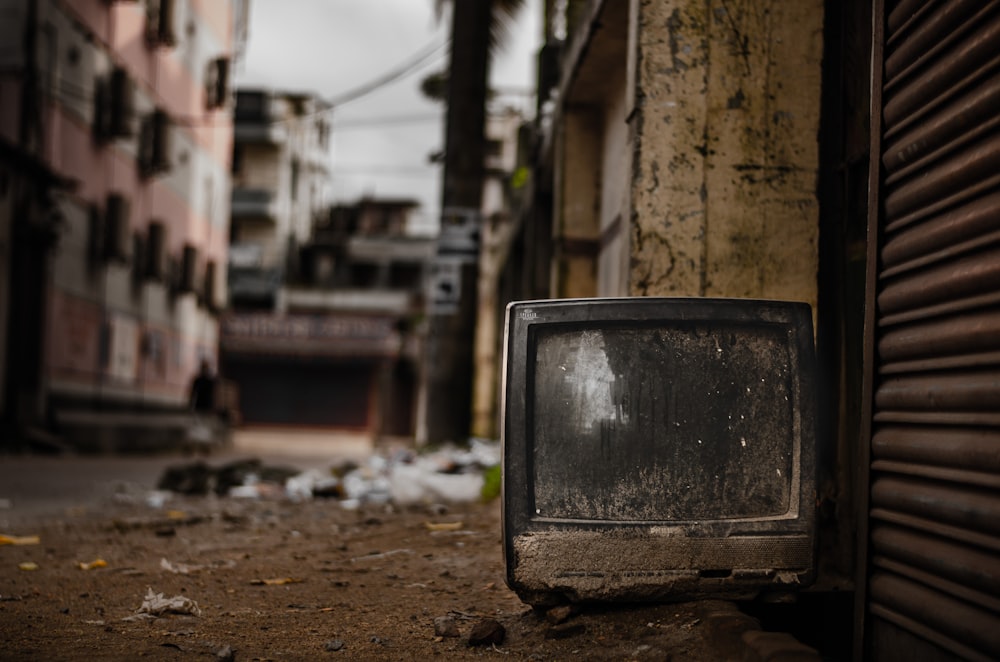 black crt tv on gray concrete floor