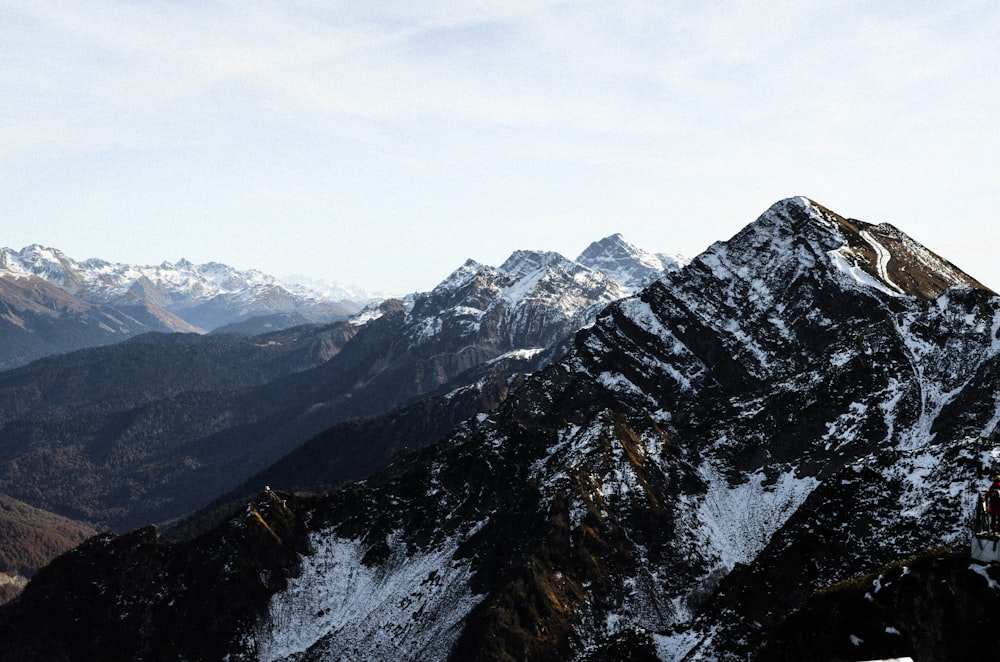 gray and white mountains under white sky during daytime