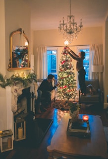 man in black suit standing beside woman in black long sleeve shirt