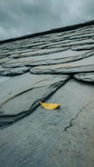 yellow umbrella on gray concrete floor