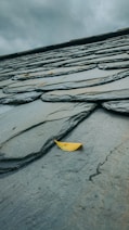 yellow umbrella on gray concrete floor