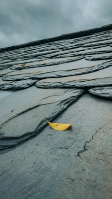 yellow umbrella on gray concrete floor