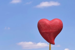 red heart balloon under blue sky during daytime