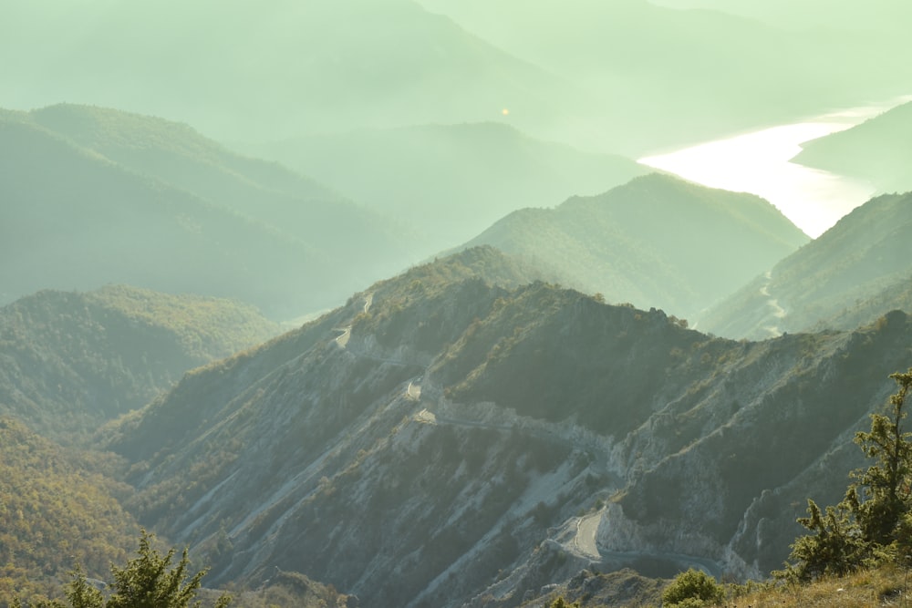 green and black mountains under white sky during daytime