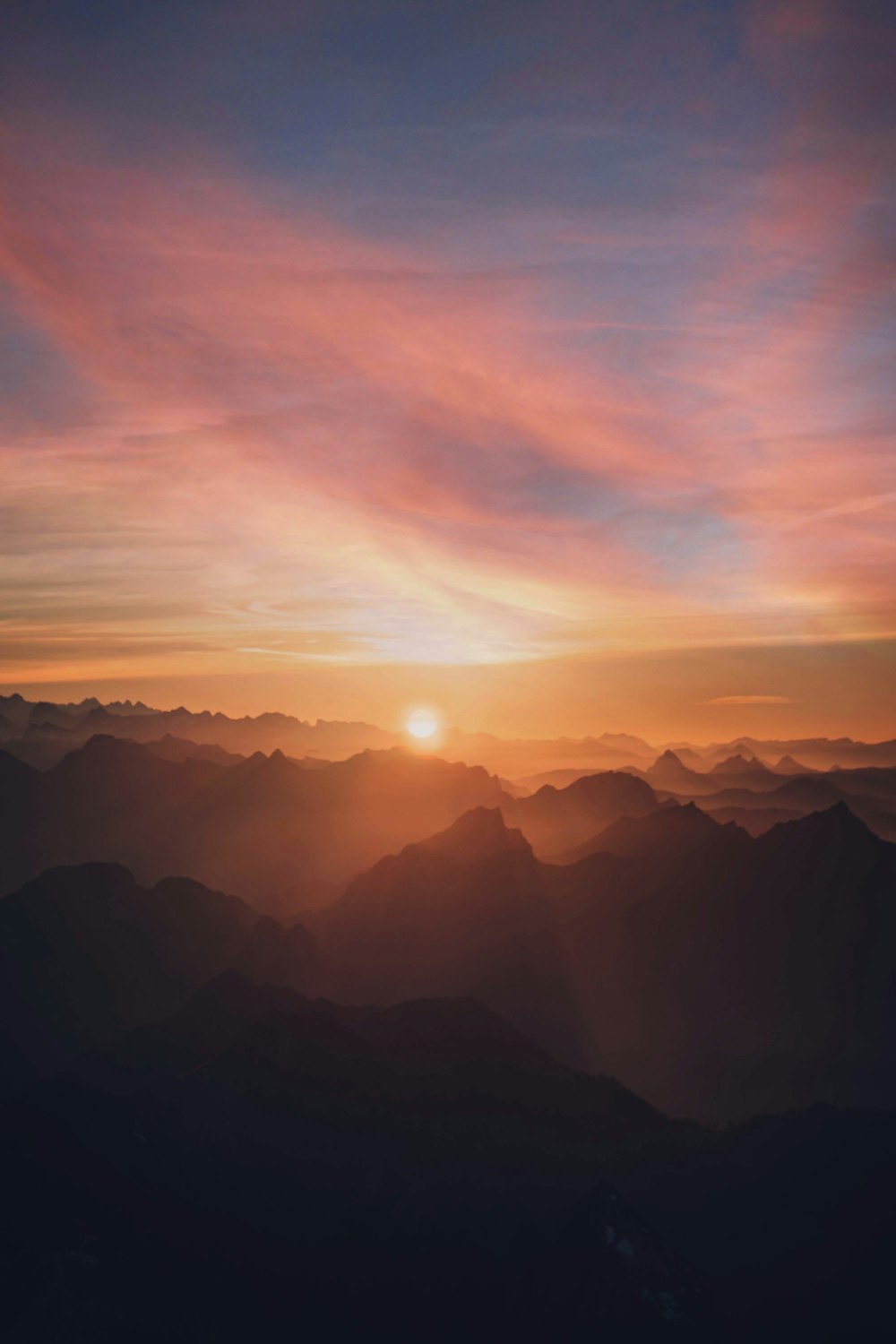 silhouette of mountains during sunset