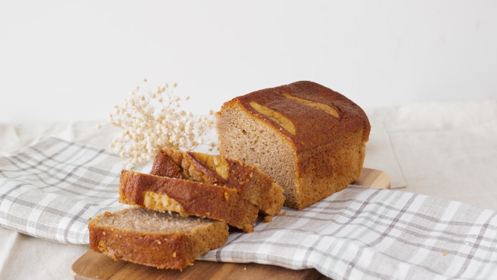 brown bread on white and blue checkered textile