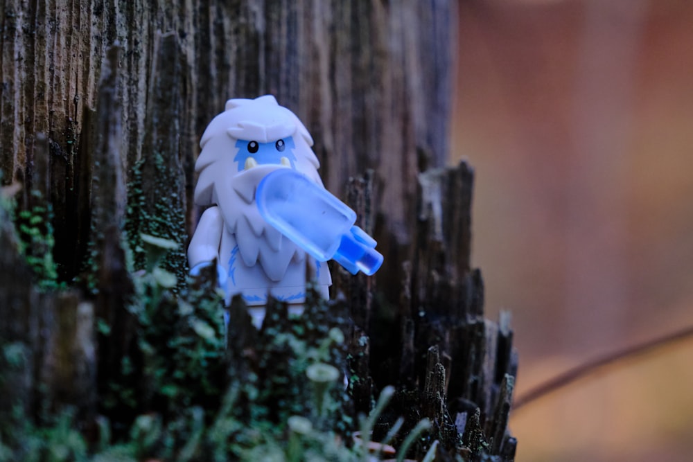 white angel figurine on tree branch