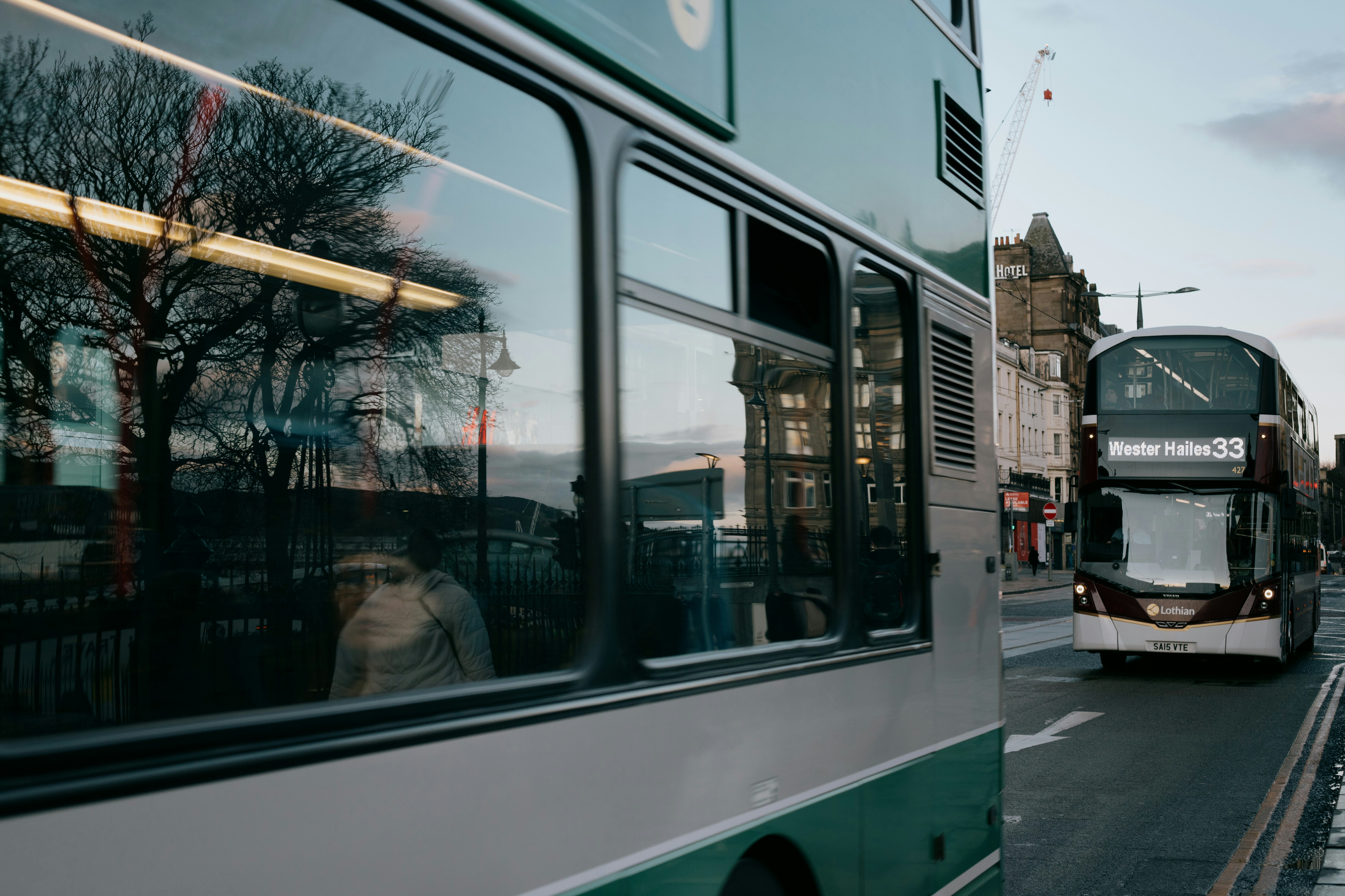 white and blue bus on road during daytime