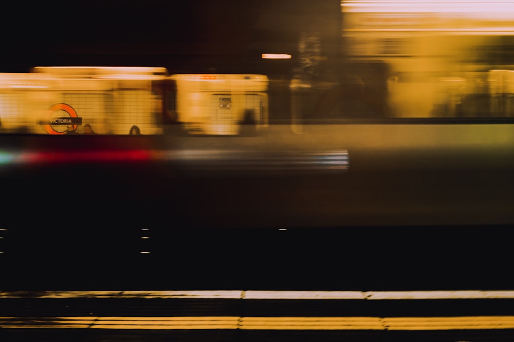 yellow bus on road during night time