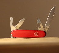 red and silver multi tool