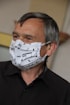 man in black suit jacket with white mask