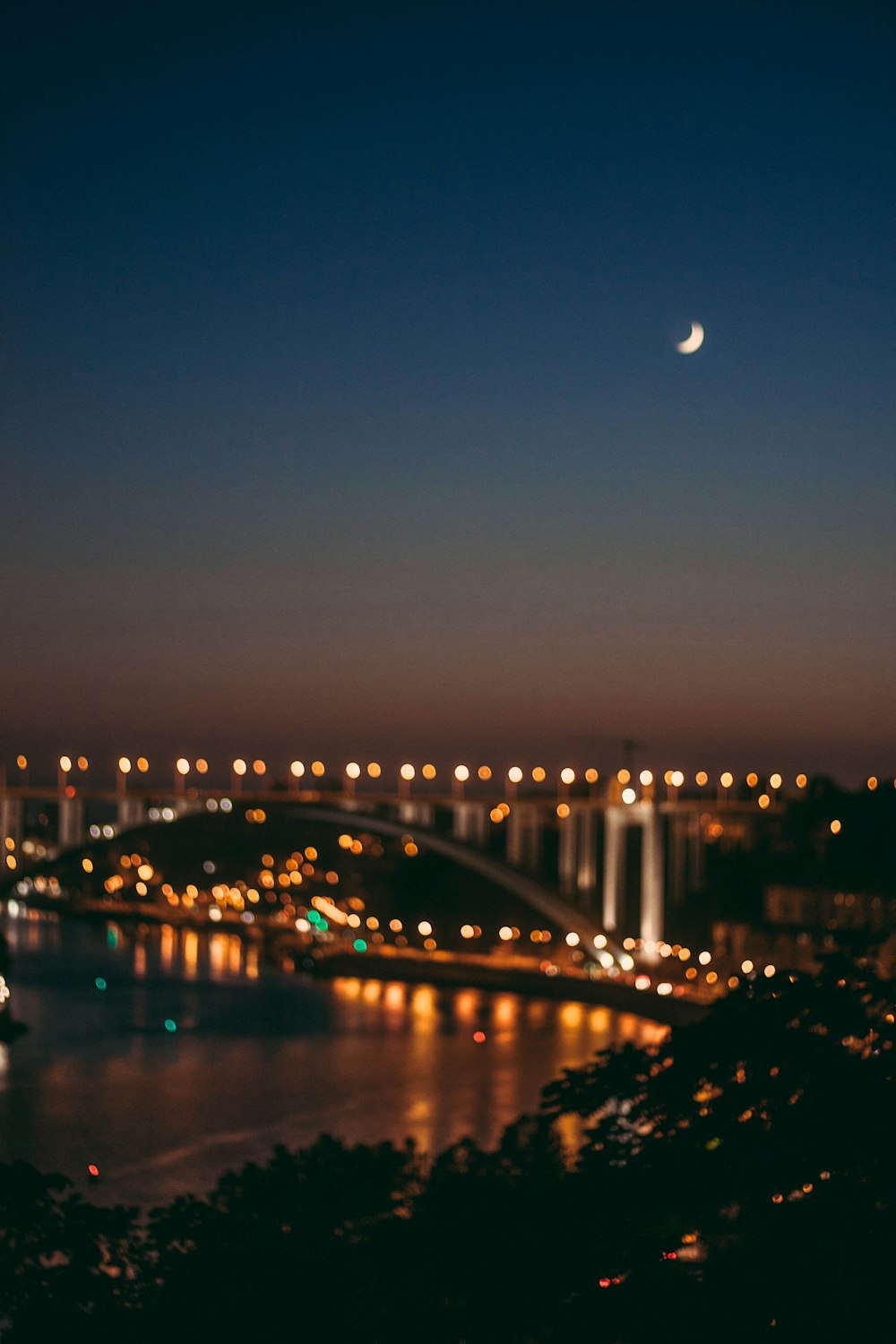 bridge over water during night time