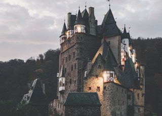 brown and black concrete castle under cloudy sky during daytime