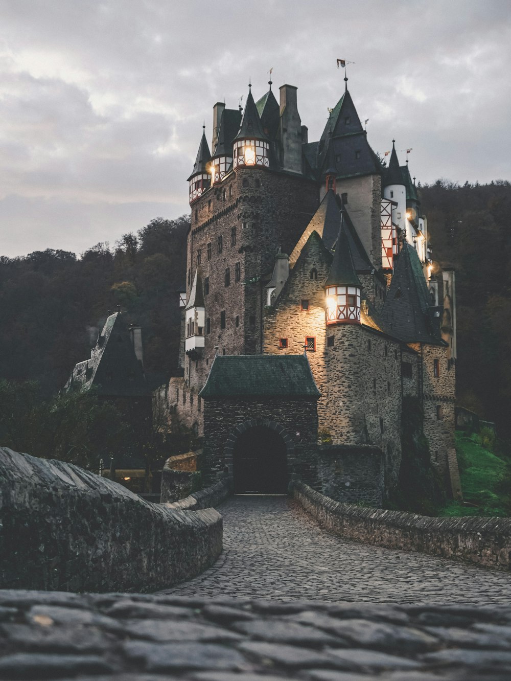 brown and black concrete castle under cloudy sky during daytime