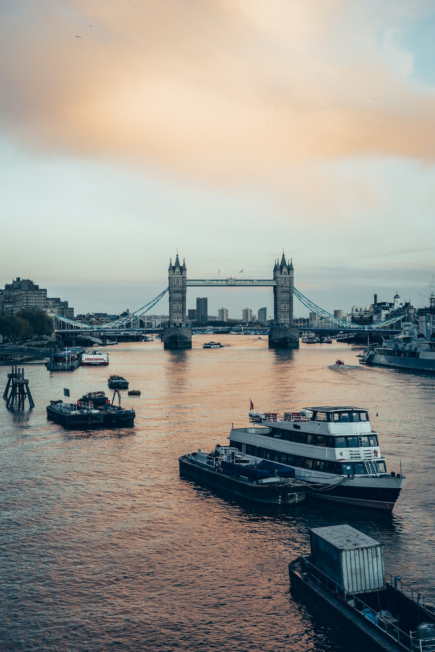 Tower Bridge over the Thames in London, with a boat passing beneath