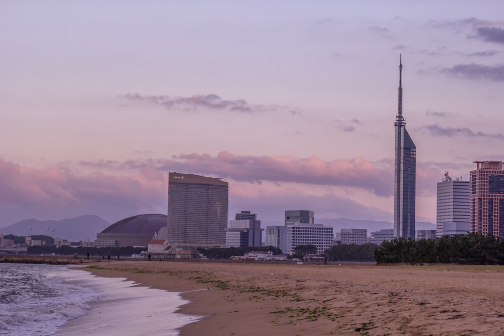 city skyline under white clouds during daytime