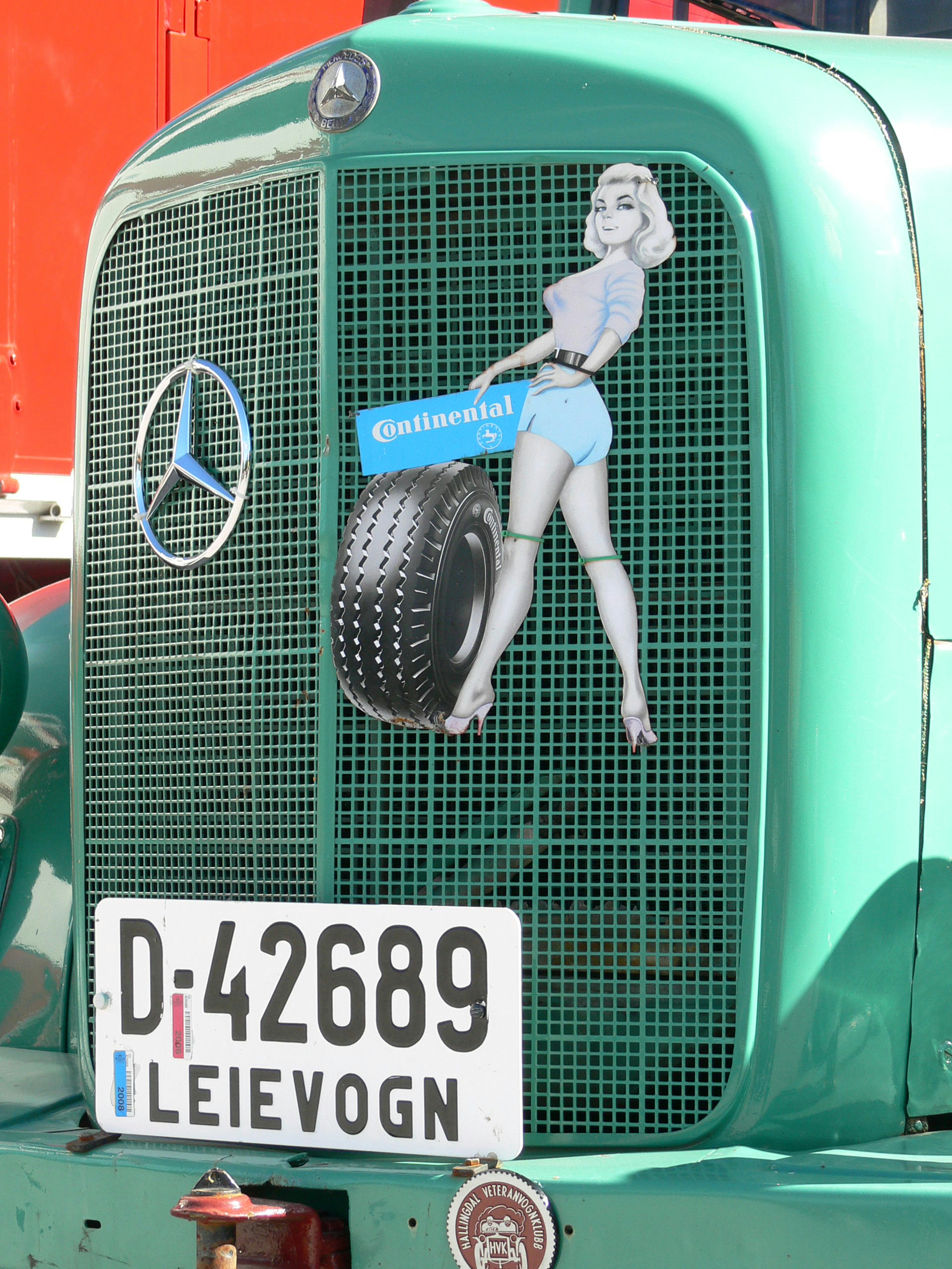 vintage truck on display, with continental tyre advert.