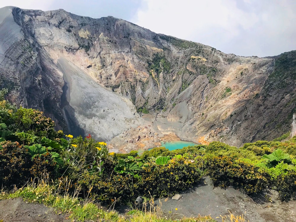 lake in the middle of mountains during daytime