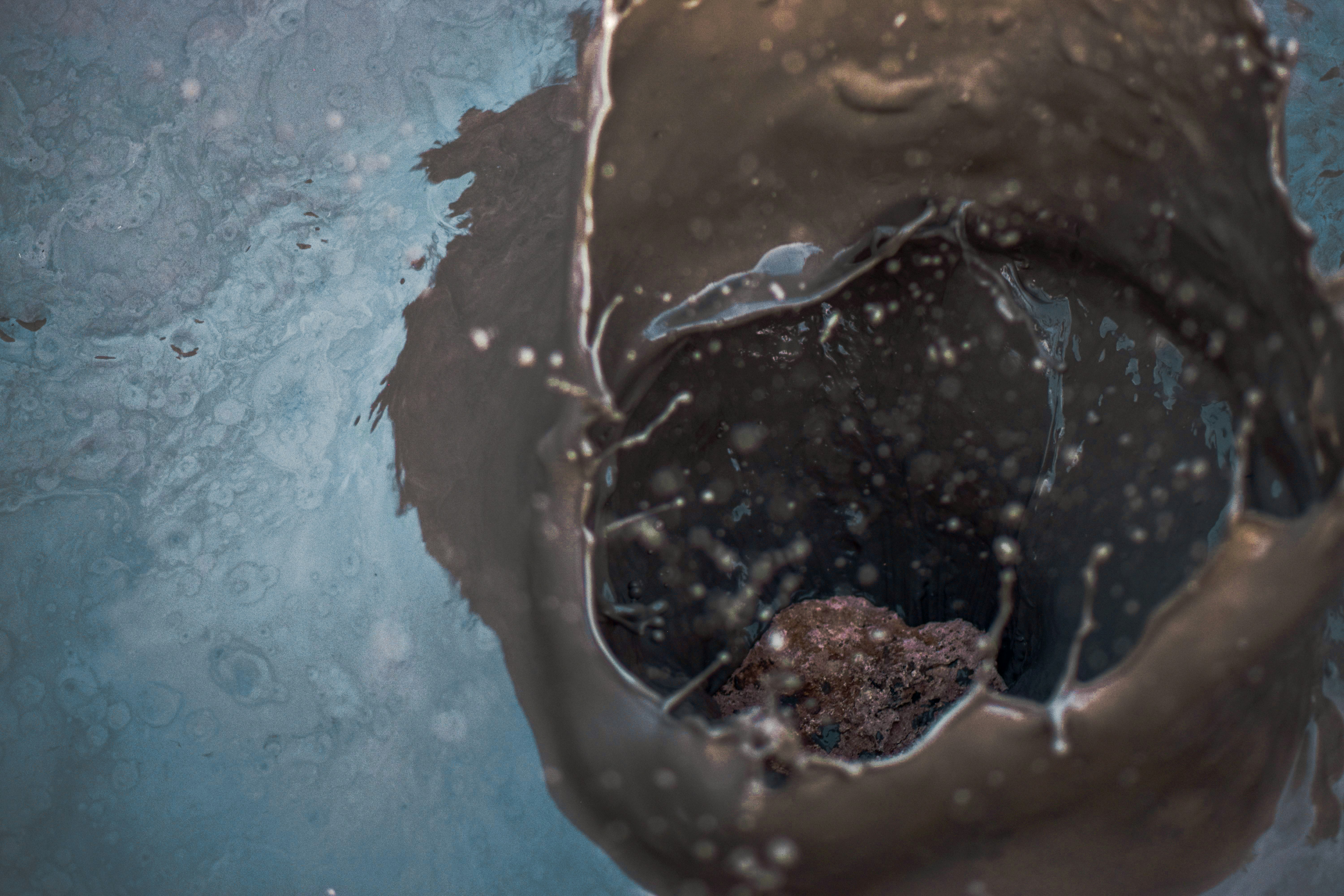 white and blue water on brown sand