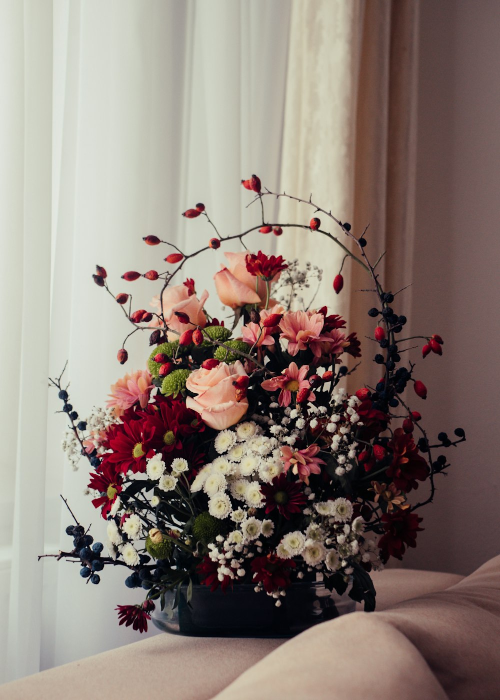 red and white flowers on vase