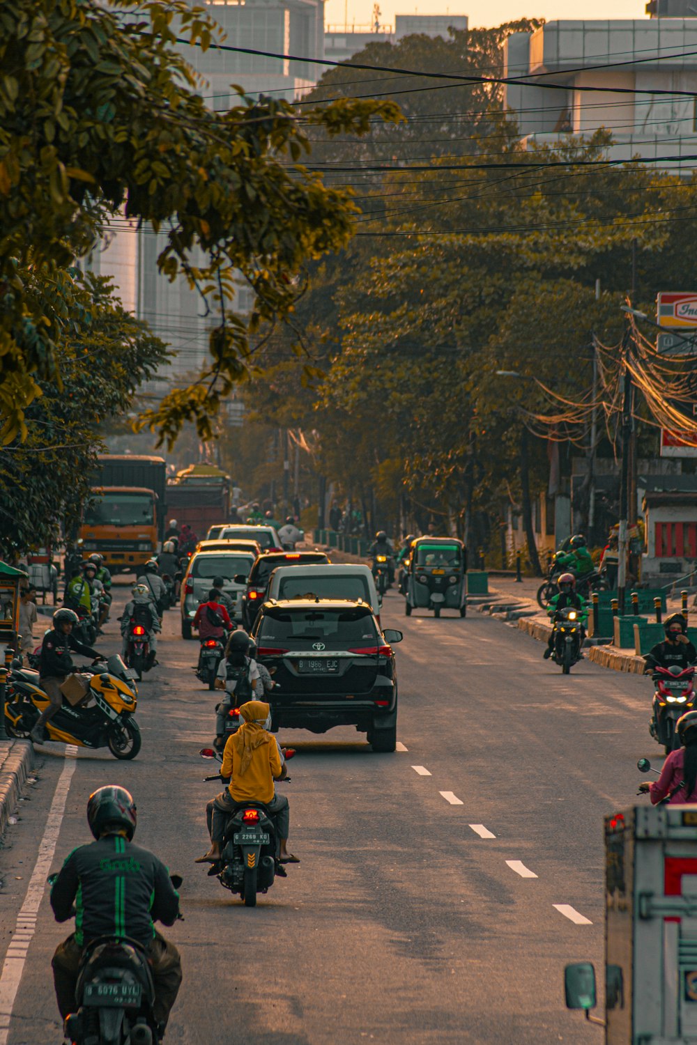 people riding motorcycle on road during daytime