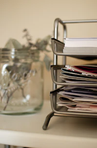white printer papers on clear glass table