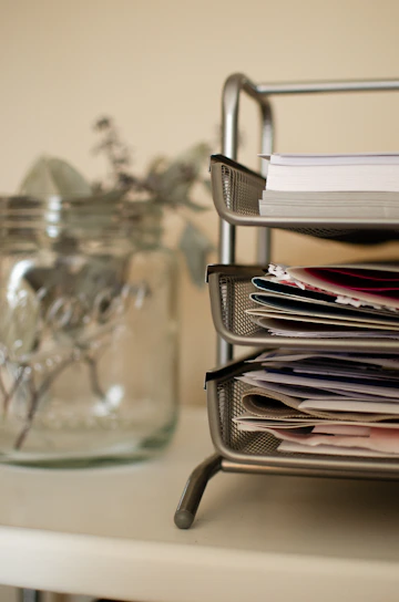 white printer papers on clear glass table