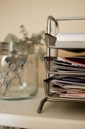 white printer papers on clear glass table