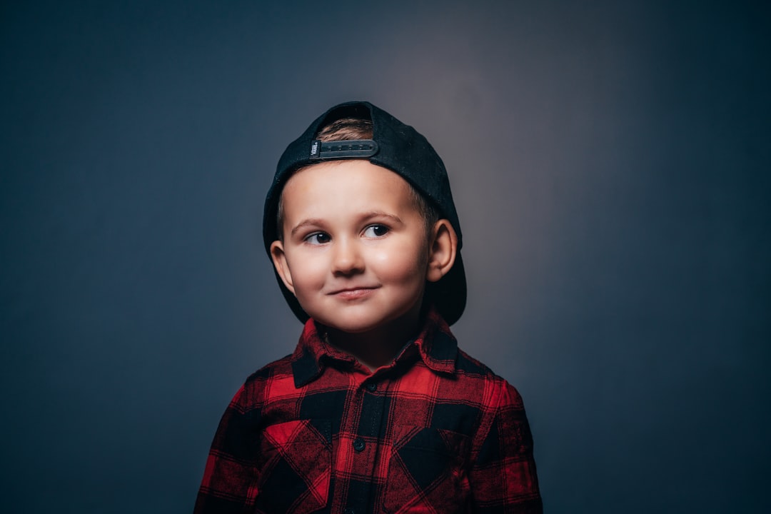 boy in black and red plaid button up shirt