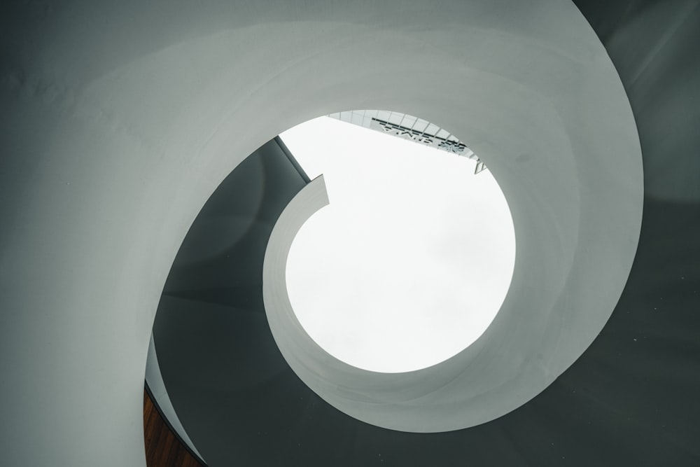 white round ceiling with brown wooden ceiling