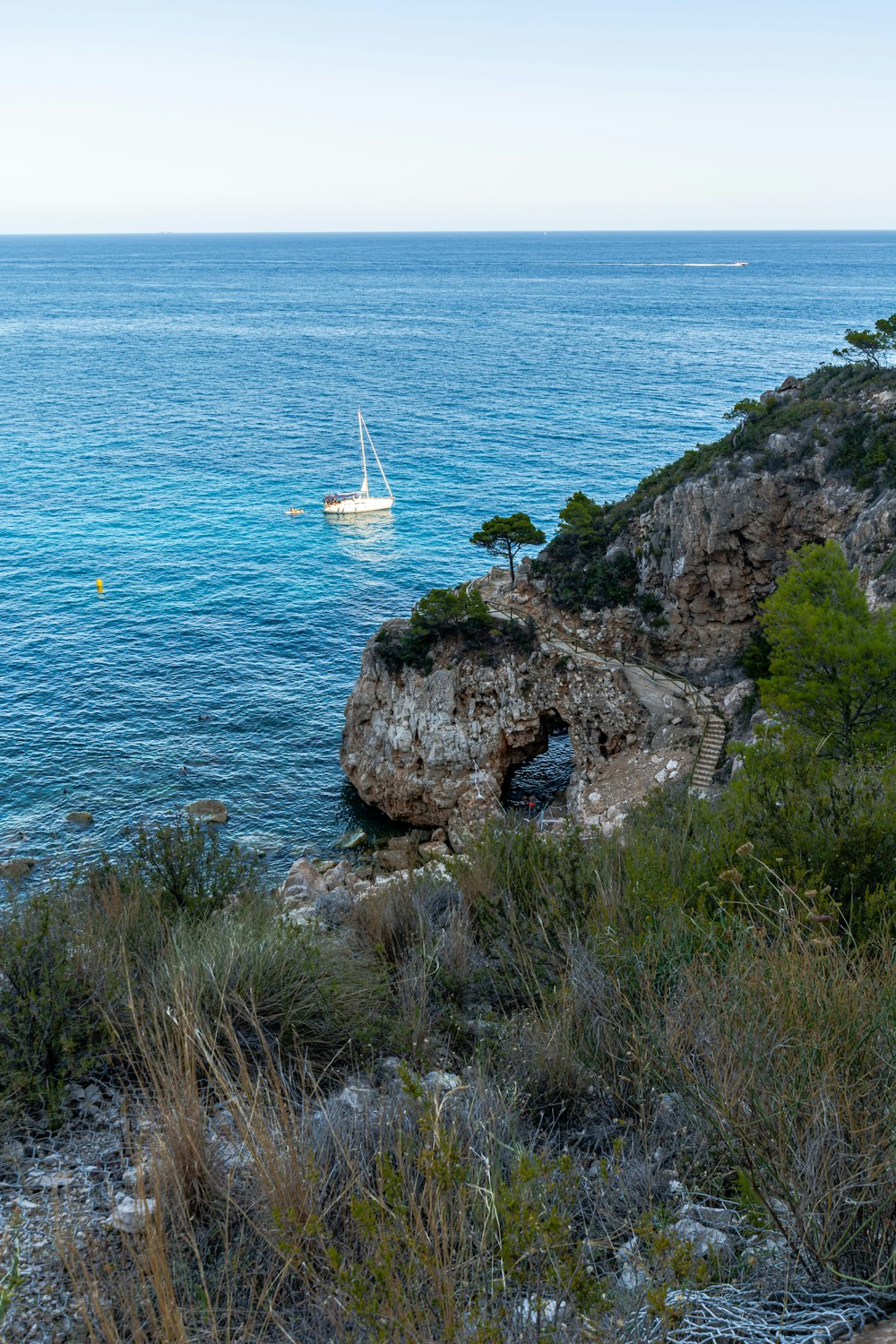 white sailboat on sea during daytime