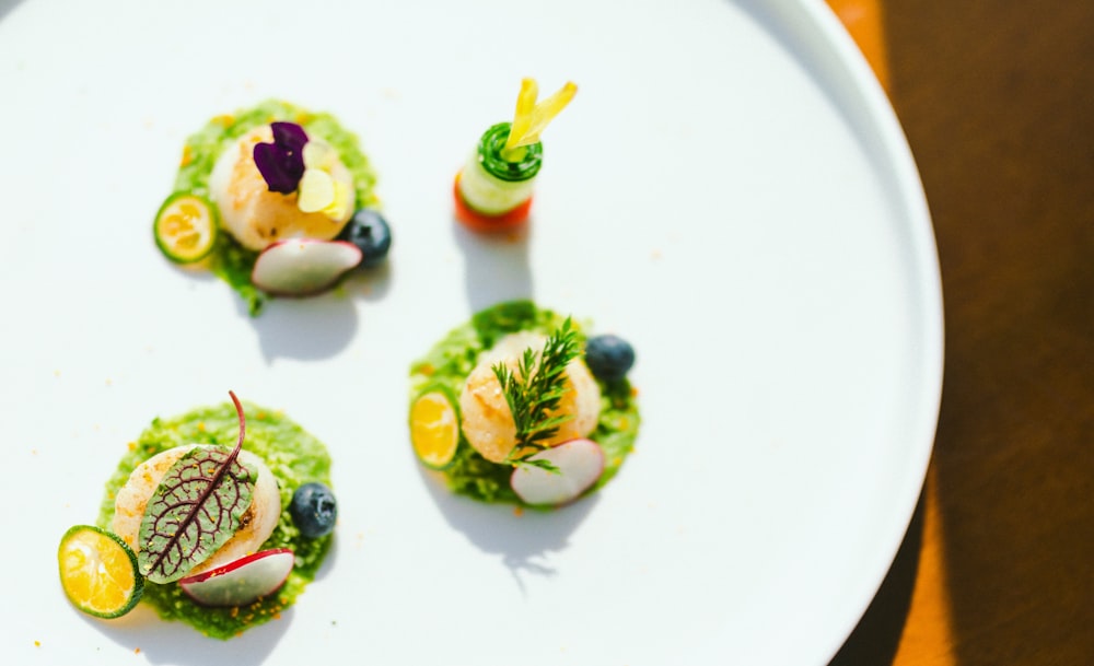 green and white sushi on white ceramic plate