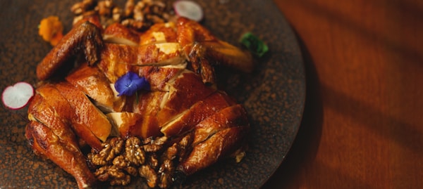 Cooked meat on black plate