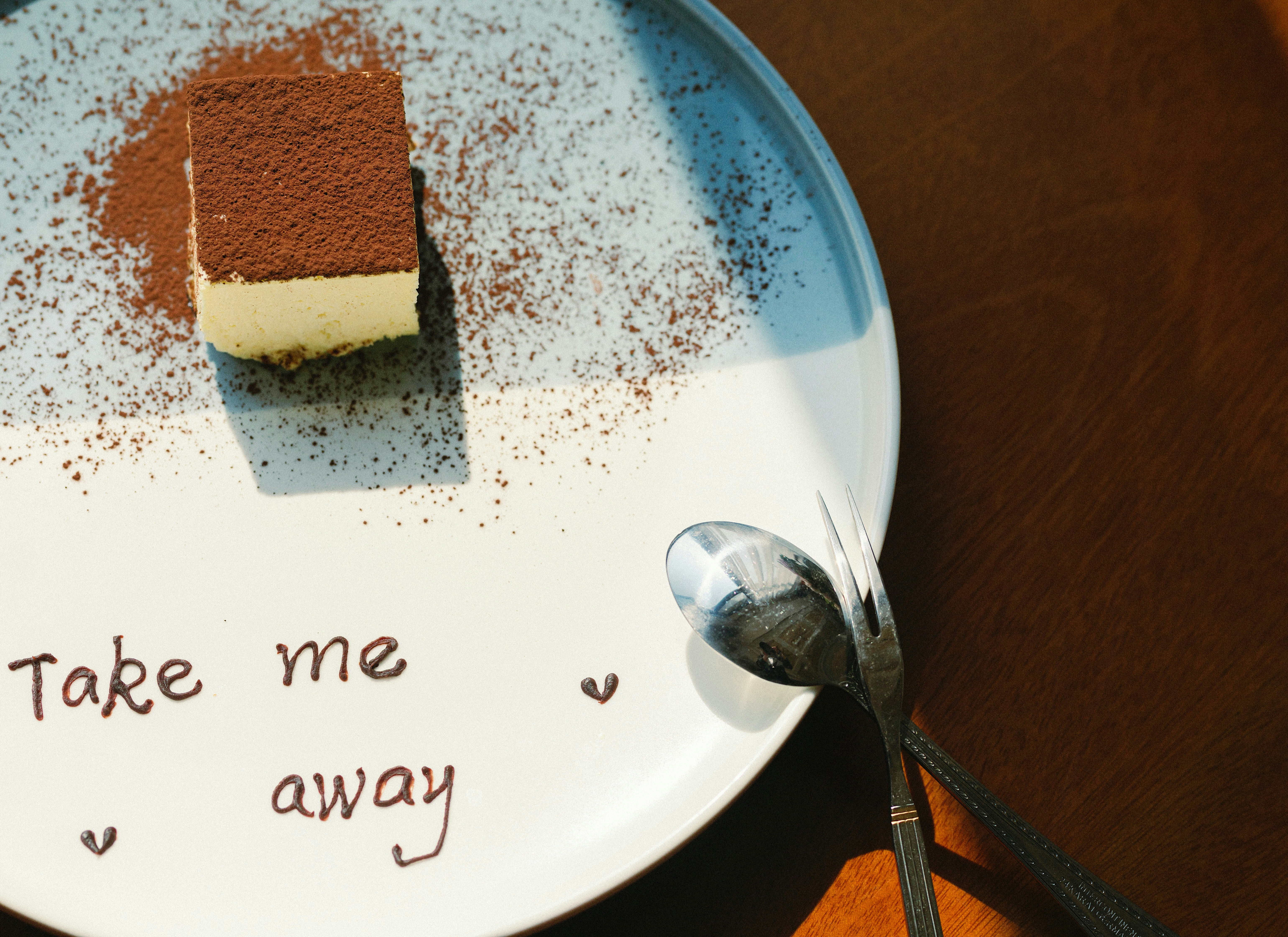 brown and white cake on white ceramic plate
