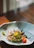 Close-up of a steaming crab dish beautifully plated at The Golden Claw.