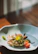 Close-up of a steaming crab dish beautifully plated at The Golden Claw.