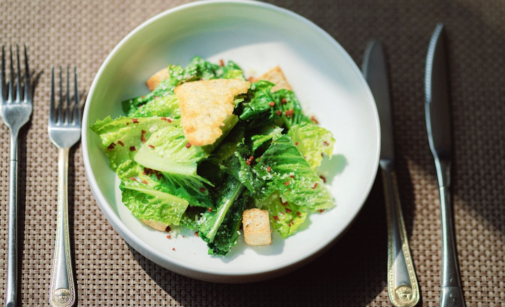 green vegetable on white ceramic plate