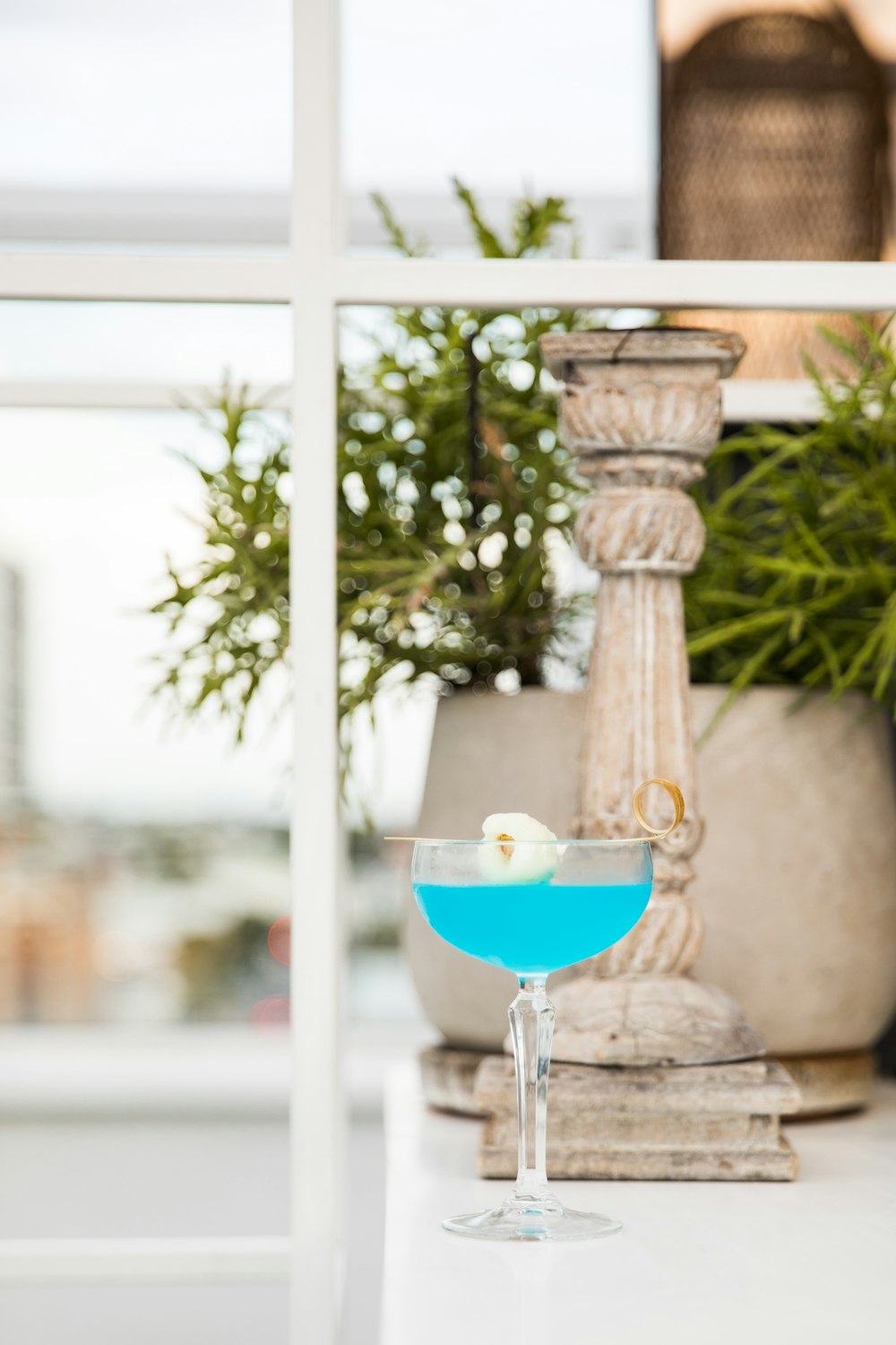 clear glass bowl on brown concrete stand