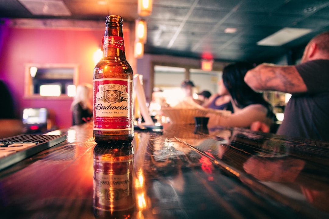 brown glass bottle on table