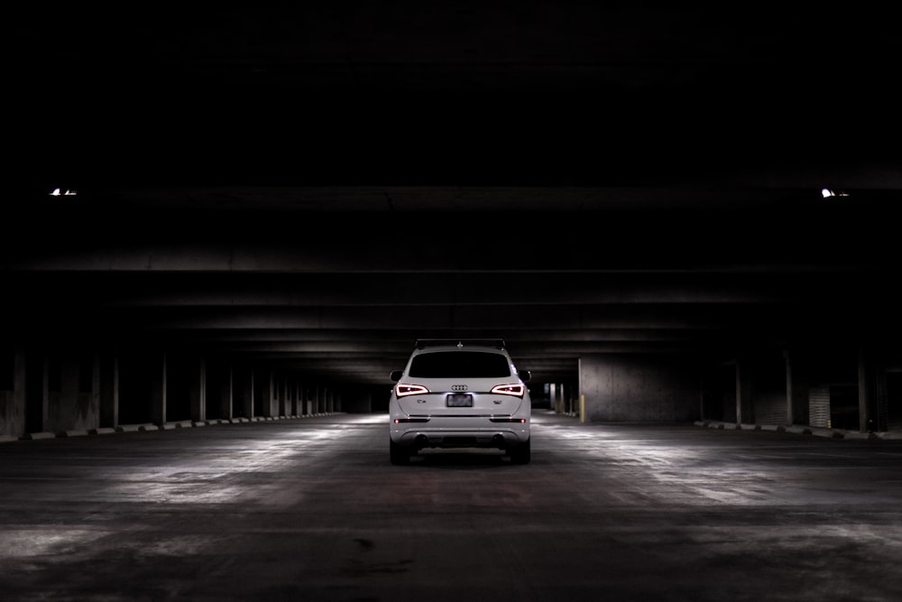 white car on road during night time