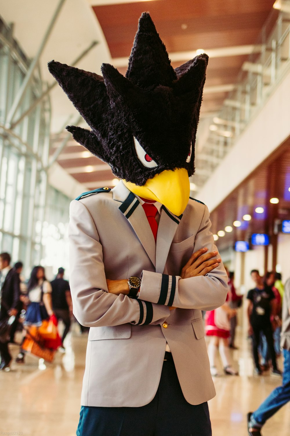 man in white suit with black hat