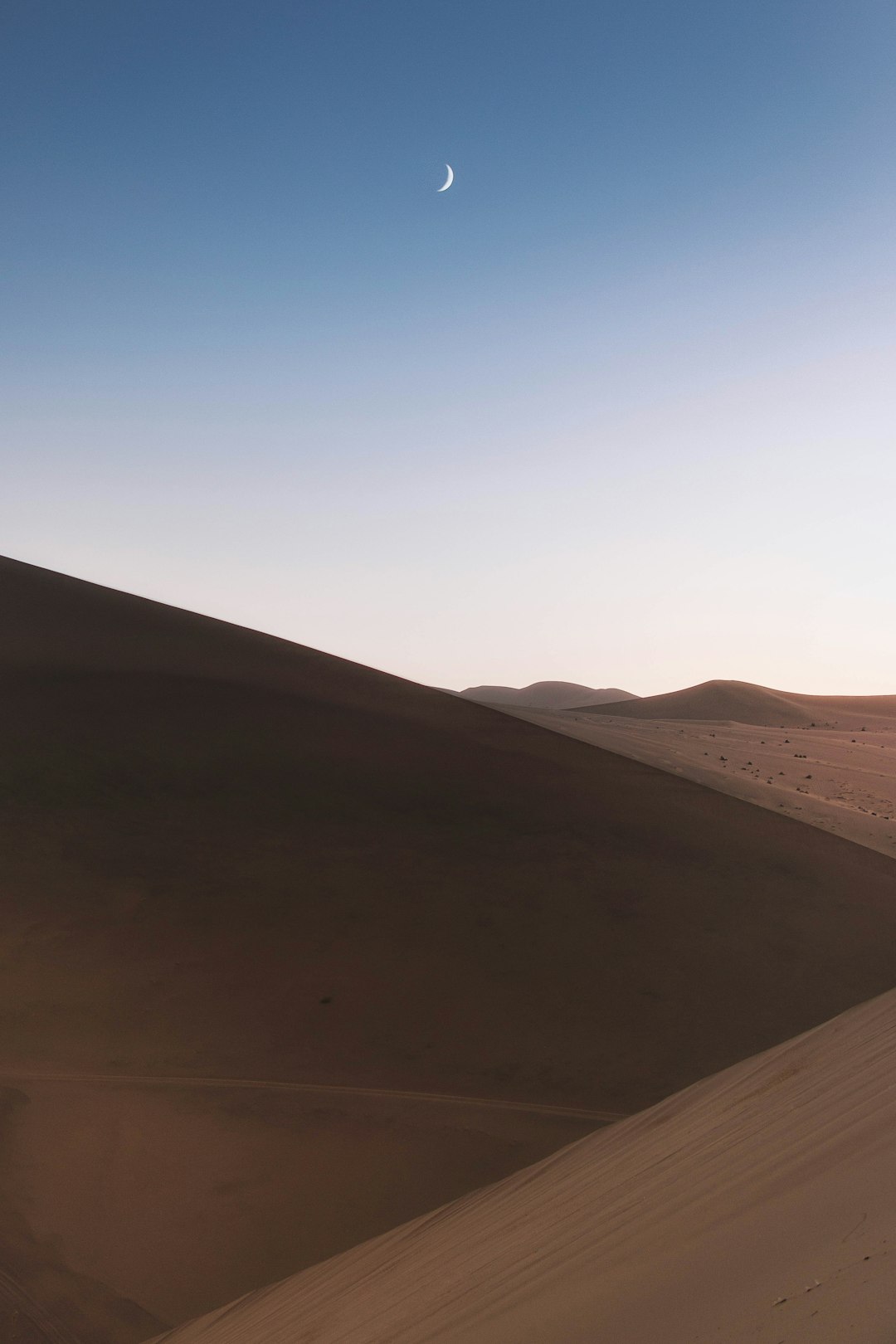 brown sand under blue sky during daytime