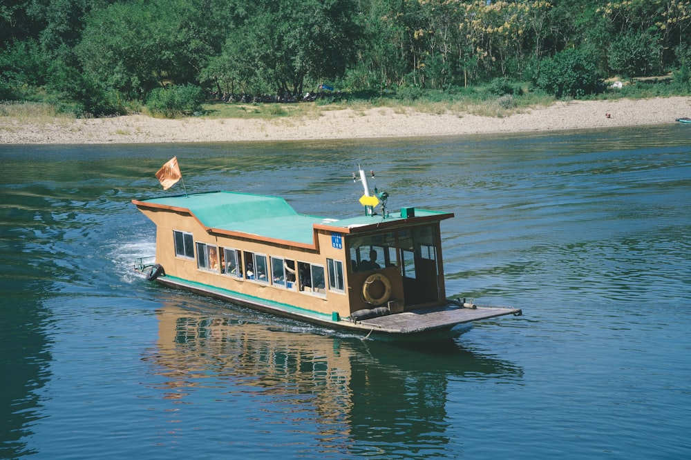 yellow and brown boat on body of water during daytime