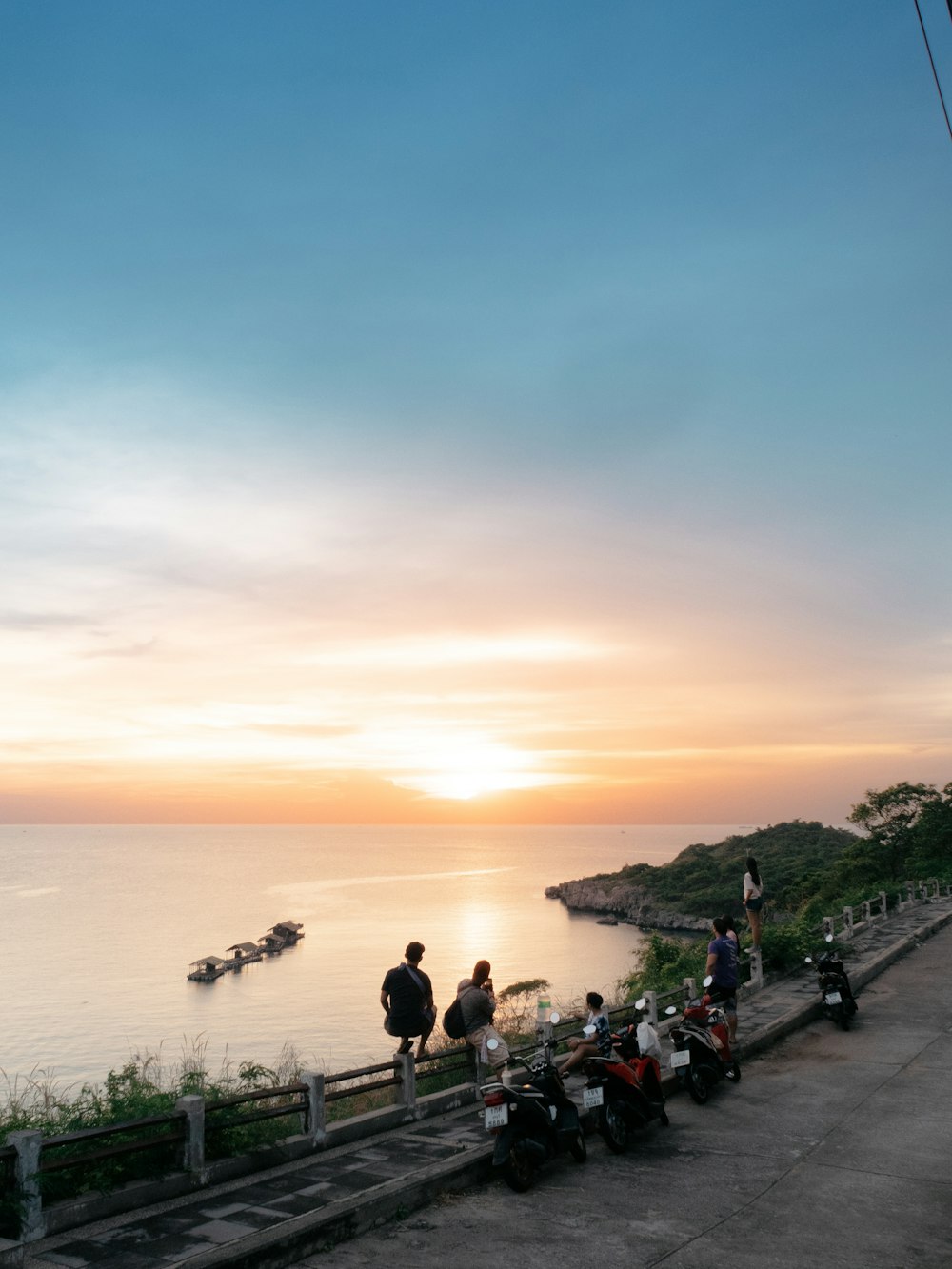 people on beach during sunset