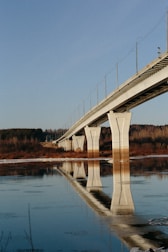 white bridge over river during daytime