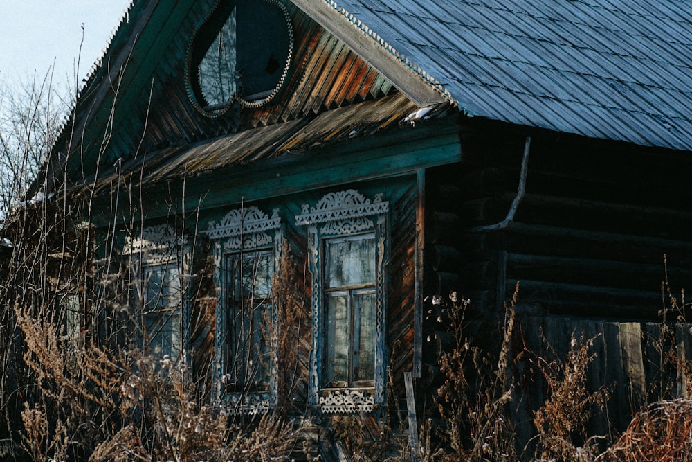 brown wooden house with brown plants