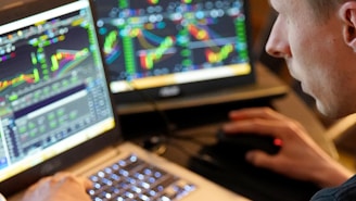 person using black and silver laptop computer