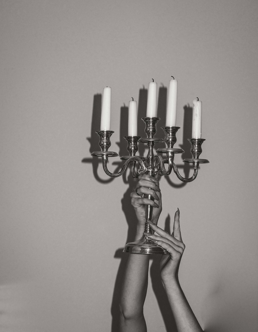 gold candle holder with white candles