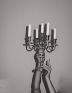 gold candle holder with white candles